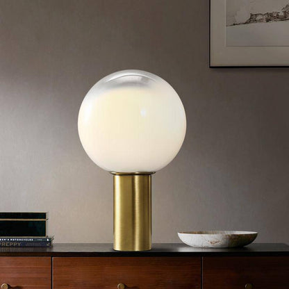 Designer LED bordslampa med gyllene cylindrisk form och vit glaskula
