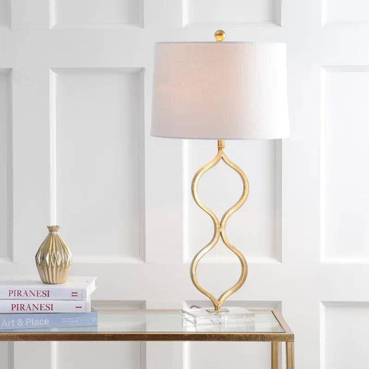 Designer LED-bordslampa med böjd guldstam och cylindrisk lampskärm