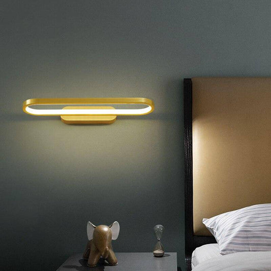 Designer LED-vägglampa med rundade gyllene former
